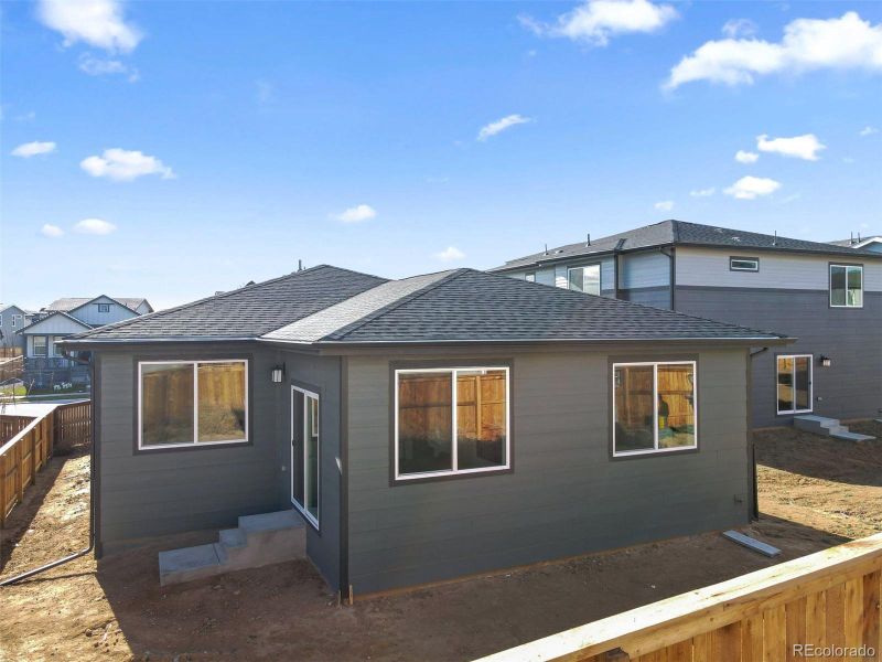 Exterior details and patio area of a home in The Cottages Collection at Ridgeline Vista, Brighton (Image 4).