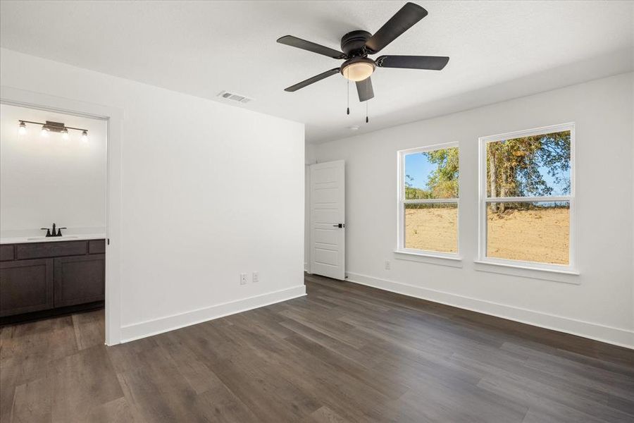 Primary bedroom, ample natural light. Split floor plan offering plenty of privacy. Primary bedroom, ample natural light. Split floor plan offering plenty of privacy.