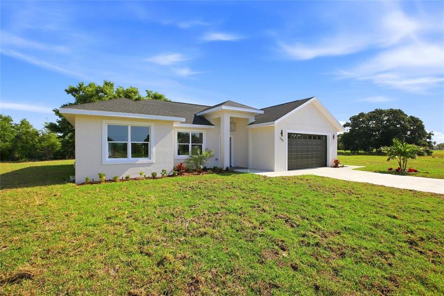 Front exterior of a new home in , Sebring, FL, highlighting curb appeal (Image 19).