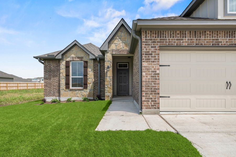 Front exterior of a new home in Hartrick Ranch, Temple, TX, highlighting curb appeal (Image 13).