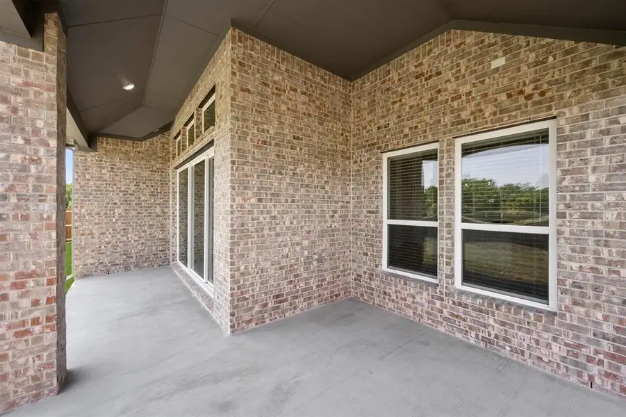 Exterior details and patio area of a home in Oaks of North Grove, Waxahachie (Image 17). Exterior details and patio area of a home in Oaks of North Grove, Waxahachie (Image 17).