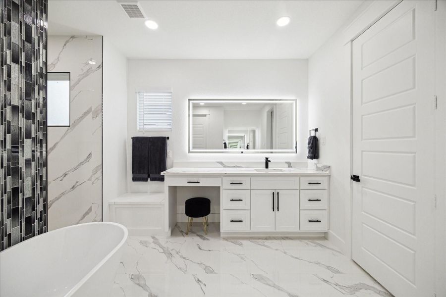 Primary Bathroom has double sinks and a vanity area Primary Bathroom has double sinks and a vanity area