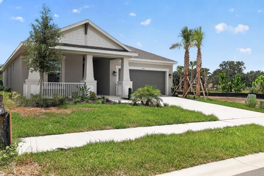Front exterior of a new home in Timber Ridge, Plant City, FL, highlighting curb appeal (Image 18). Front exterior of a new home in Timber Ridge, Plant City, FL, highlighting curb appeal (Image 18).