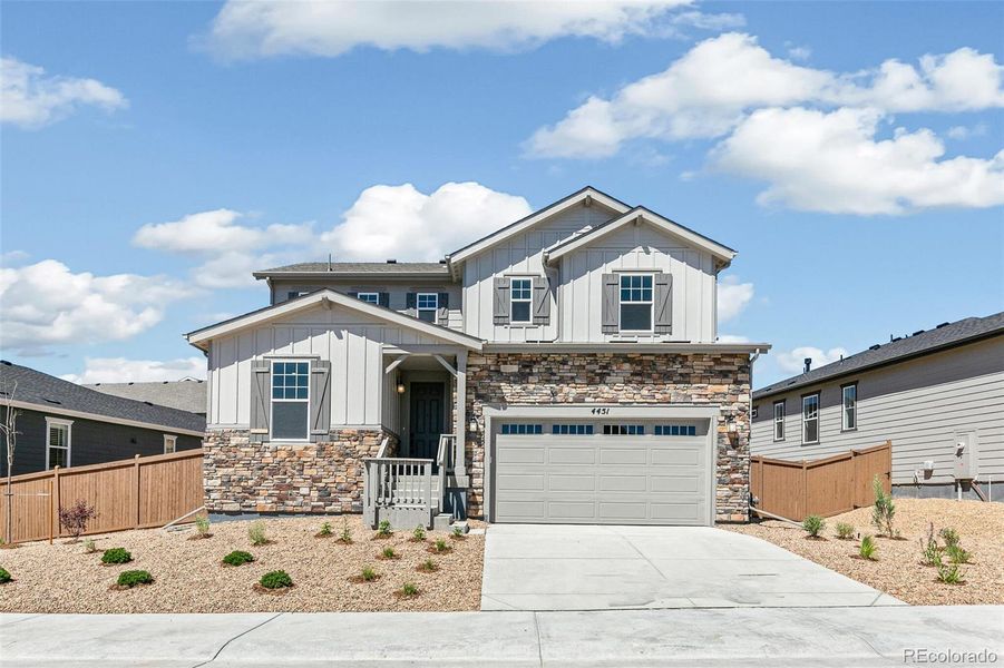 Front exterior of a new home in Terrain Oak Valley, Castle Rock, CO, highlighting curb appeal (Image 2).