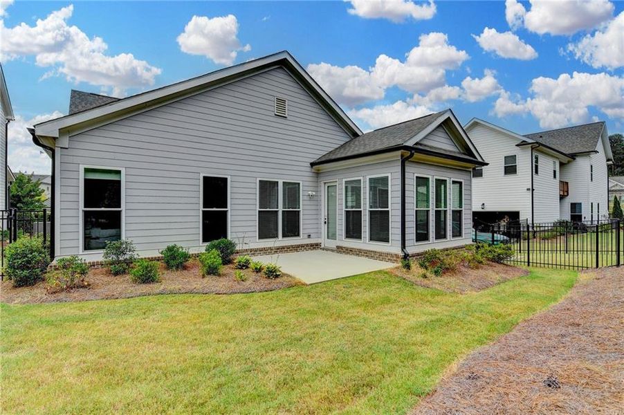 Exterior details and patio area of a home in Ellington Townhomes, Suwanee (Image 3).