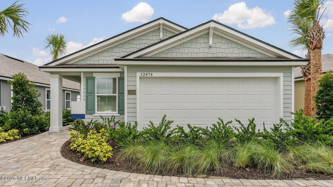 Front exterior of a new home in The Arbors, Jacksonville, FL, highlighting curb appeal (Image 27).