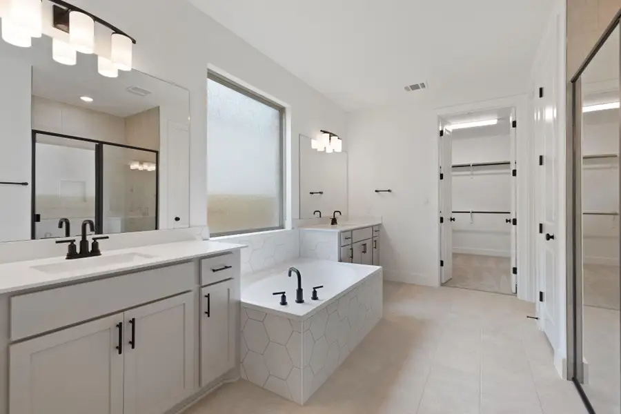 Primary Bath retreat with dual vanities & garden tub