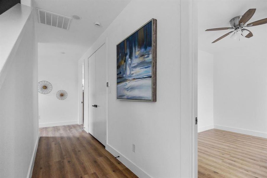 Hallway featuring wood-type flooring