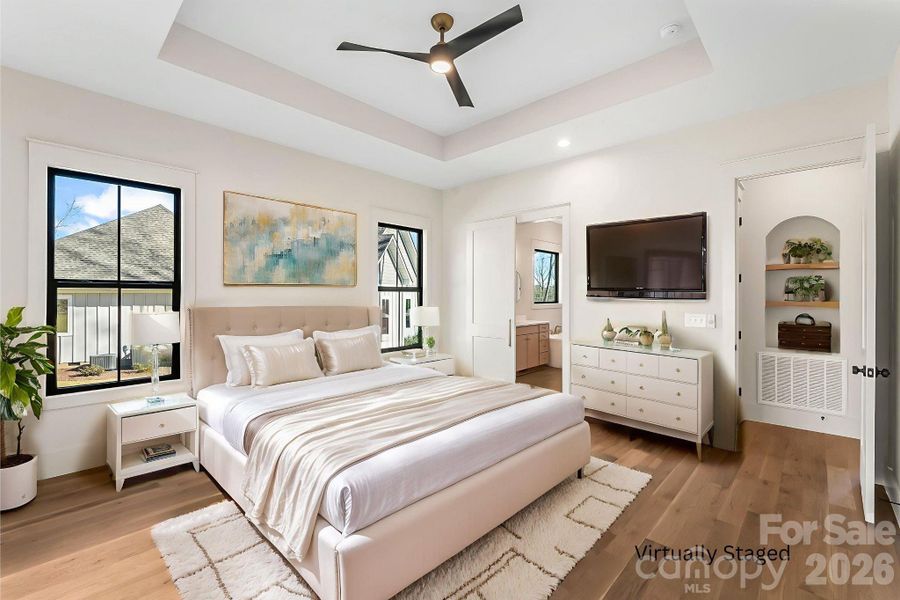 Spacious primary suite with sliding doors that open directly to the backyard, creating a peaceful indoor-outdoor connection.