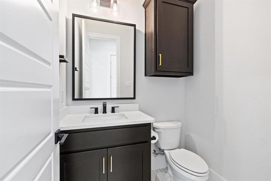 Bathroom featuring toilet and vanity