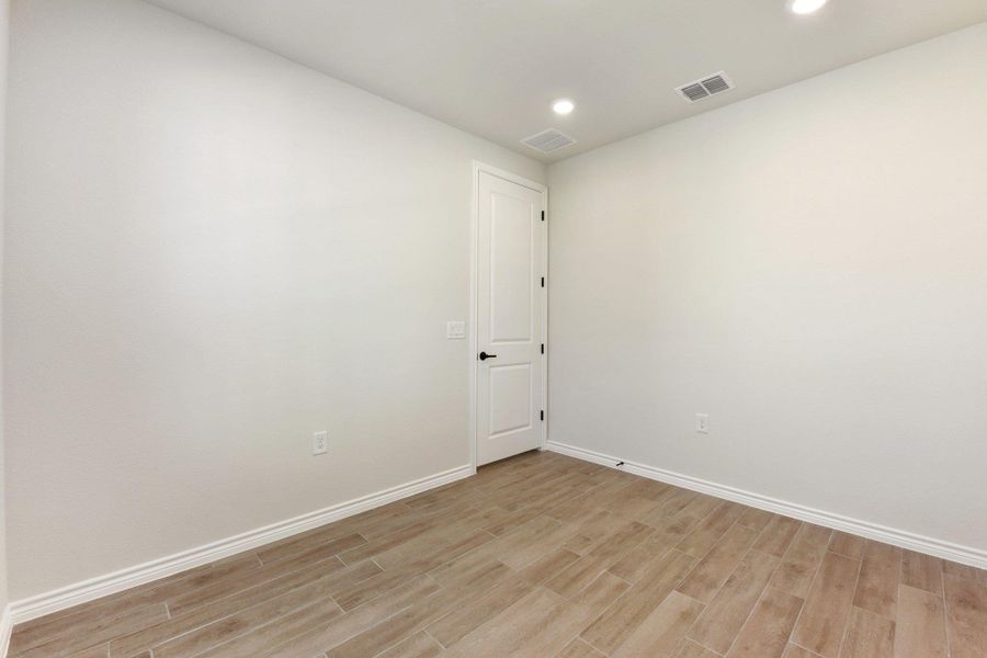 Empty room featuring recessed lighting and light wood finished floors