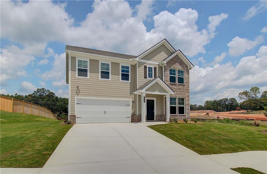Front exterior of a new home in Chapel Hill, Newnan, GA, highlighting curb appeal (Image 2). Front exterior of a new home in Chapel Hill, Newnan, GA, highlighting curb appeal (Image 2).