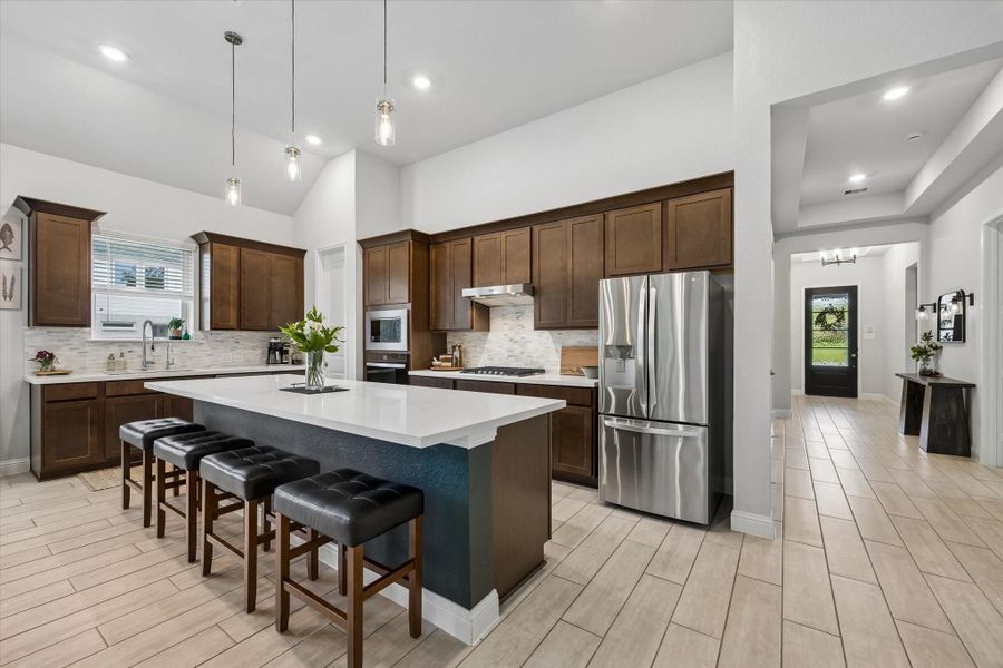 Gourmet kitchen overlooking the living area—perfect for keeping the chef connected to the conversation. Gourmet kitchen overlooking the living area—perfect for keeping the chef connected to the conversation.