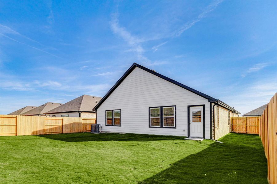 The fully fenced backyard offers privacy, security, and room to grow. Freshly sodded and spacious, it’s ideal for a play set, garden beds, or a future outdoor kitchen. The extended back wall adds architectural character from every angle. The fully fenced backyard offers privacy, security, and room to grow. Freshly sodded and spacious, it’s ideal for a play set, garden beds, or a future outdoor kitchen. The extended back wall adds architectural character from every angle.