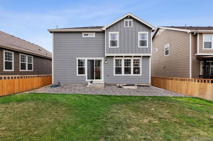 Front exterior of a new home in Sweetgrass, Dacono, CO, highlighting curb appeal (Image 1).