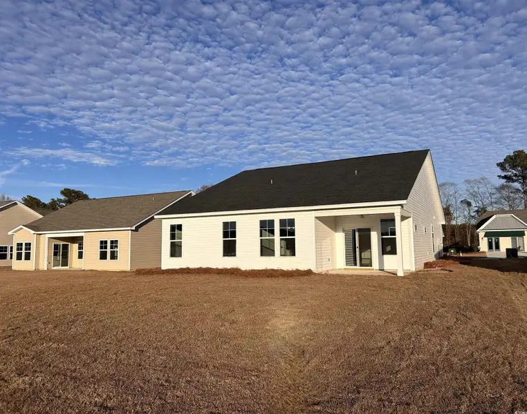Rear view of house featuring a patio area