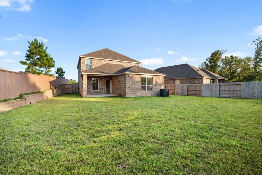 Exterior details and patio area of a home in Wedgewood Forest, Conroe (Image 2). Exterior details and patio area of a home in Wedgewood Forest, Conroe (Image 2).
