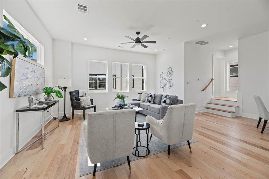 Another view of the living room.  Up the stairs, tucked away on the landing is a convenient half bath.