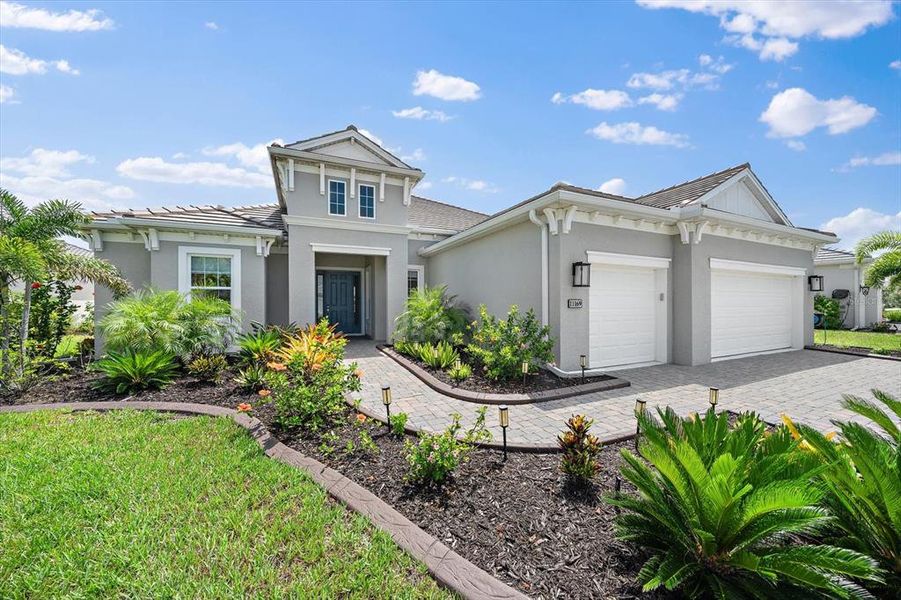 Front exterior of a new home in , Englewood, FL, highlighting curb appeal (Image 2). Front exterior of a new home in , Englewood, FL, highlighting curb appeal (Image 2).