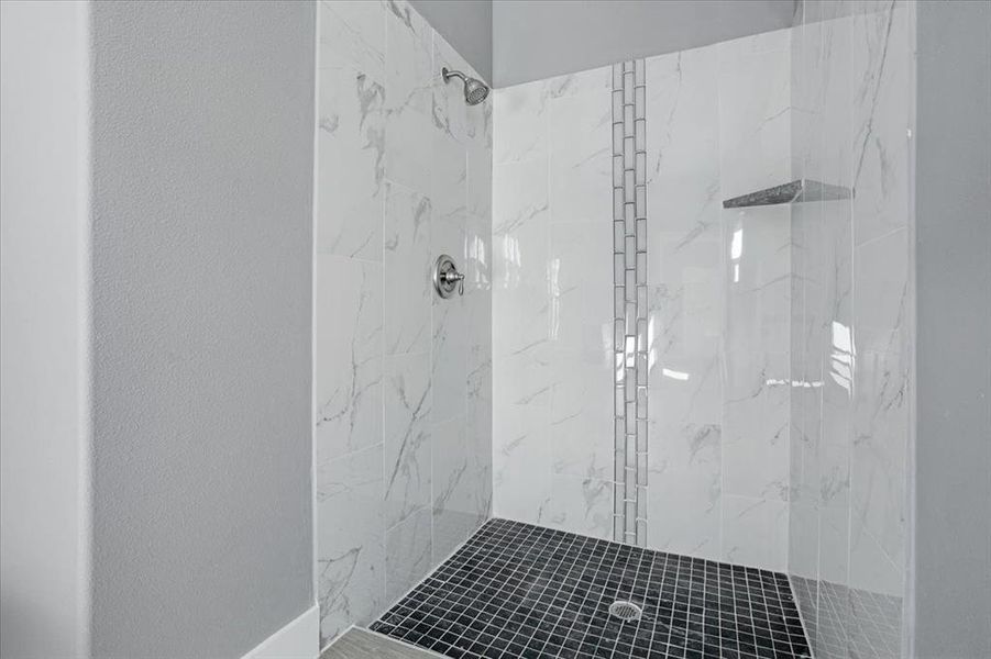 Bathroom with a tile shower