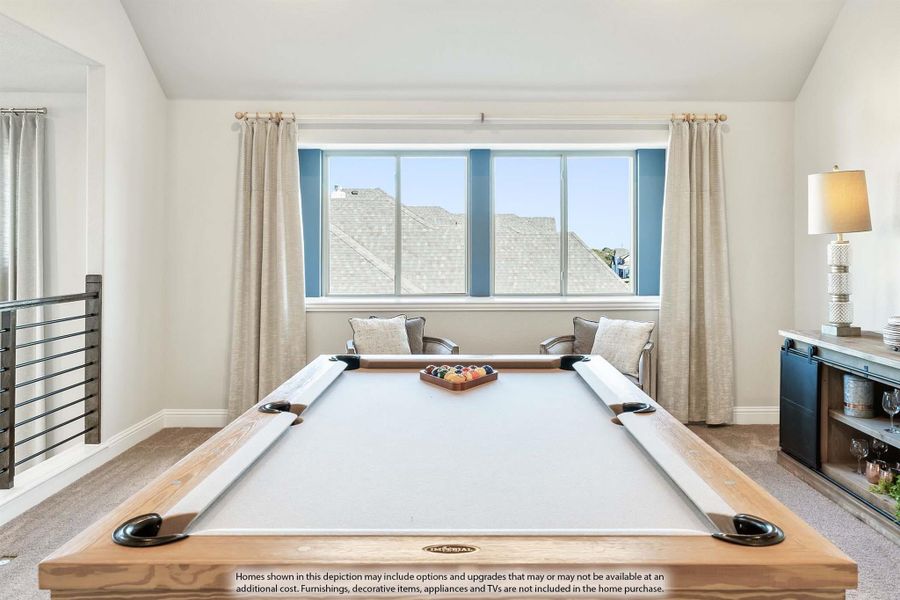 Game room with a pool table, carpeted floors, and a large window with natural light