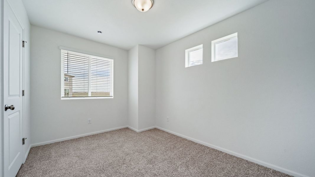 Spacious, unfurnished interior of a new home in Reunion, Commerce City (Image 15).