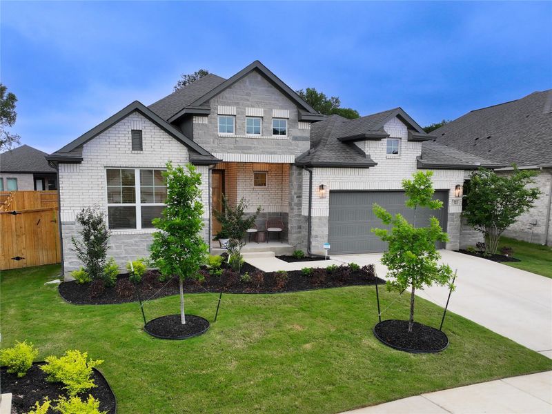 Front exterior of a new home in 6 Creeks, Kyle, TX, highlighting curb appeal (Image 1). Front exterior of a new home in 6 Creeks, Kyle, TX, highlighting curb appeal (Image 1).