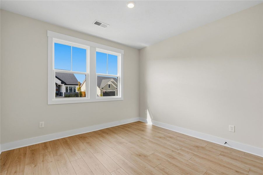 Smooth wood floors and crisp trim frame a versatil