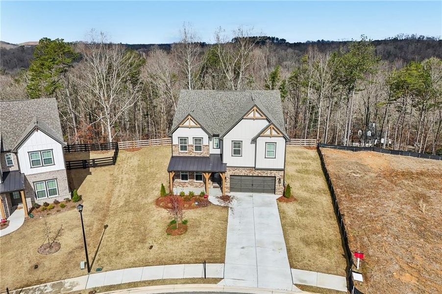 Front exterior of a new home in Tiberon Woods, Cumming, GA, highlighting curb appeal (Image 28). Front exterior of a new home in Tiberon Woods, Cumming, GA, highlighting curb appeal (Image 28).