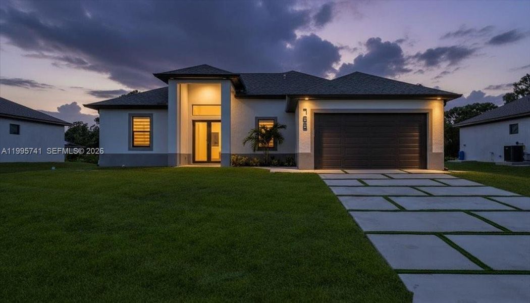 Front exterior of a new home in , Lehigh Acres, FL, highlighting curb appeal (Image 26). Front exterior of a new home in , Lehigh Acres, FL, highlighting curb appeal (Image 26).