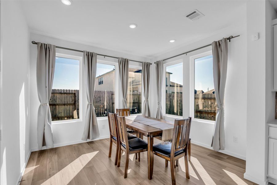 Dining Area: Surrounded by expansive windows, this dining space is filled with natural light and feels open and welcoming. It offers an inviting setting for everyday meals or gatherings, with a bright connection to the outdoors. Dining Area: Surrounded by expansive windows, this dining space is filled with natural light and feels open and welcoming. It offers an inviting setting for everyday meals or gatherings, with a bright connection to the outdoors.