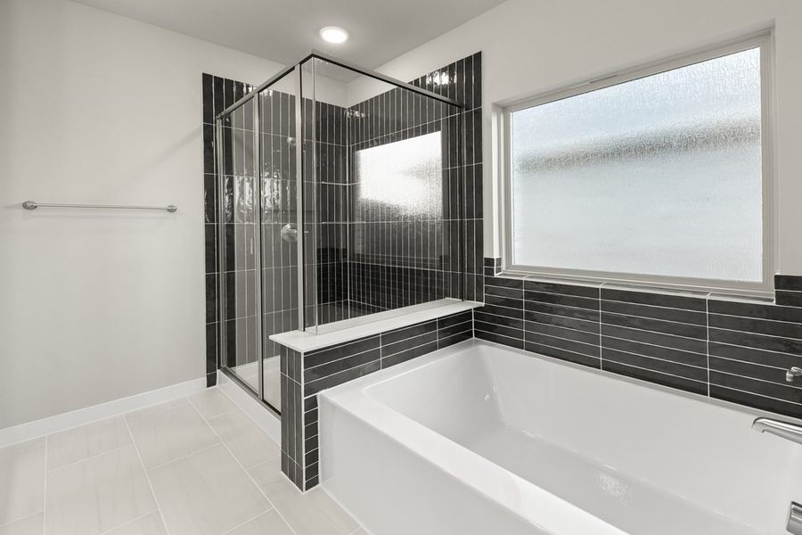 Representative furnished interior of a home built from the Hickory Sunterra 50s by Brohn Homes in Sunterra, Katy (Image 7).