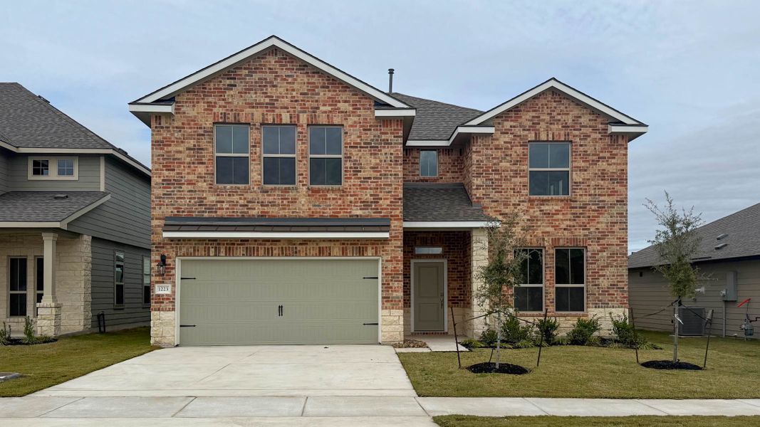 Front exterior of a new home in Southern Pointe, College Station, TX, highlighting curb appeal (Image 1).