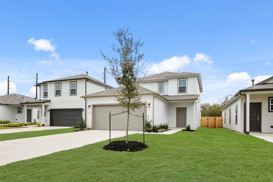 Front exterior of a new home in Barrett Crossing, Crosby, TX, highlighting curb appeal (Image 16).