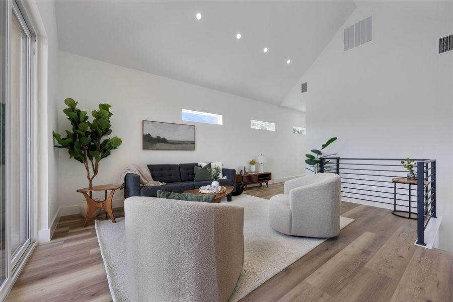 Recessed lighting, Clerestory windows for light and privacy, and modern metal stairwell railing. Recessed lighting, Clerestory windows for light and privacy, and modern metal stairwell railing.
