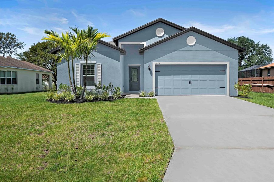 Front exterior of a new home in Port St Lucie, Port St. Lucie, FL, highlighting curb appeal (Image 13). Front exterior of a new home in Port St Lucie, Port St. Lucie, FL, highlighting curb appeal (Image 13).