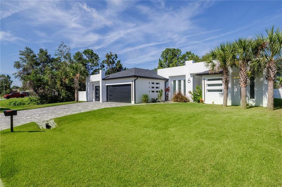 Front exterior of a new home in , Palm Coast, FL, highlighting curb appeal (Image 27).