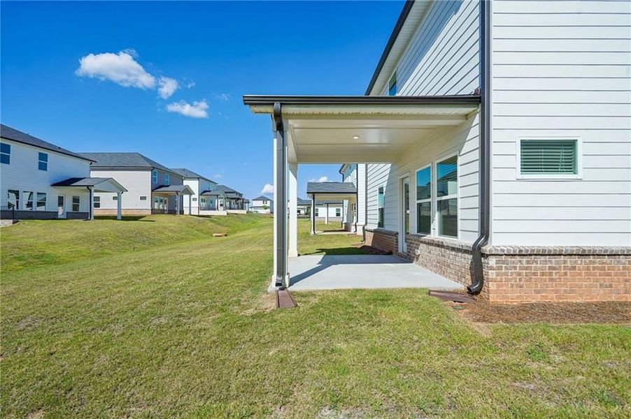 Front exterior of a new home in Martin Springs - Reserve Series, Lawrenceville, GA, highlighting curb appeal (Image 20).