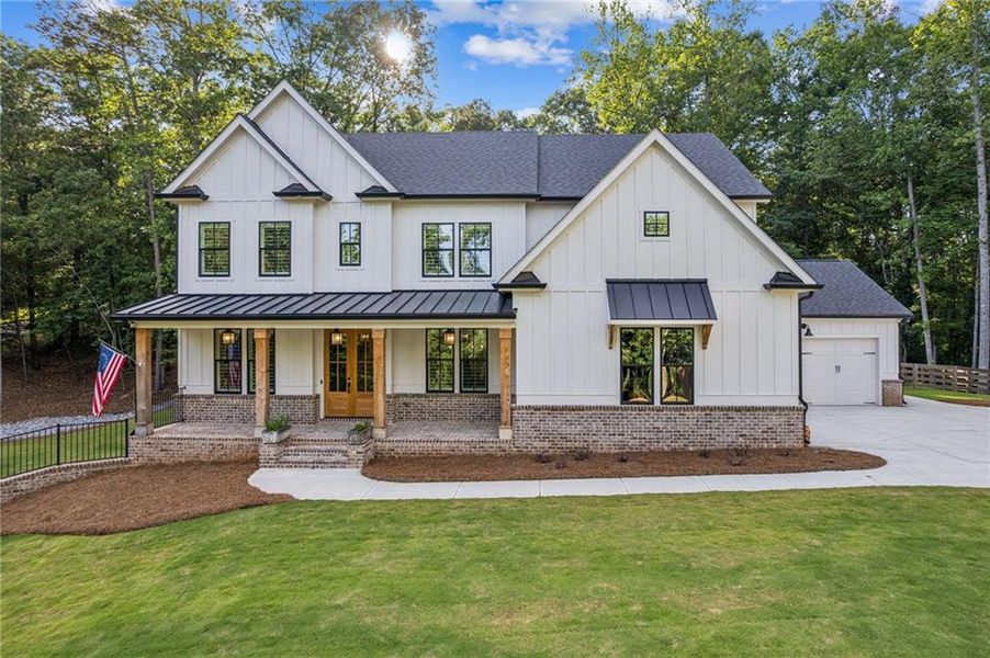 Front exterior of a new home in , Gainesville, GA, highlighting curb appeal (Image 1). Front exterior of a new home in , Gainesville, GA, highlighting curb appeal (Image 1).