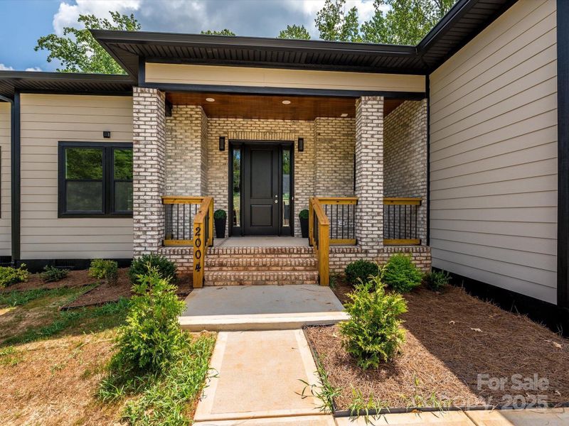 Front exterior of a new home in , Bessemer City, NC, highlighting curb appeal (Image 21). Front exterior of a new home in , Bessemer City, NC, highlighting curb appeal (Image 21).