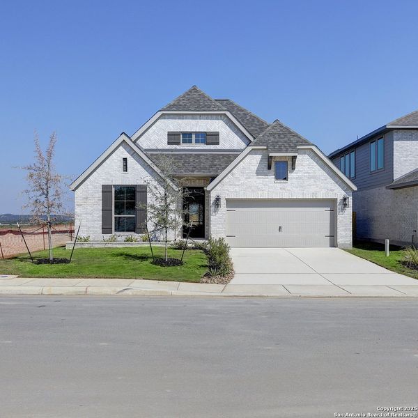 Front exterior of a new home in Arcadia Ridge 50', San Antonio, TX, highlighting curb appeal (Image 2). Front exterior of a new home in Arcadia Ridge 50', San Antonio, TX, highlighting curb appeal (Image 2).