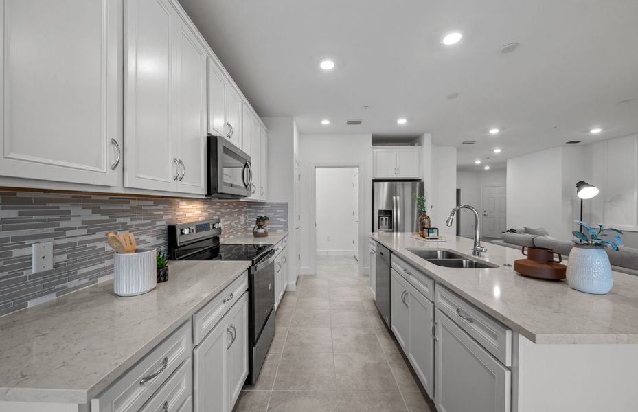 Kitchen with stainless steel appliances and ample storage