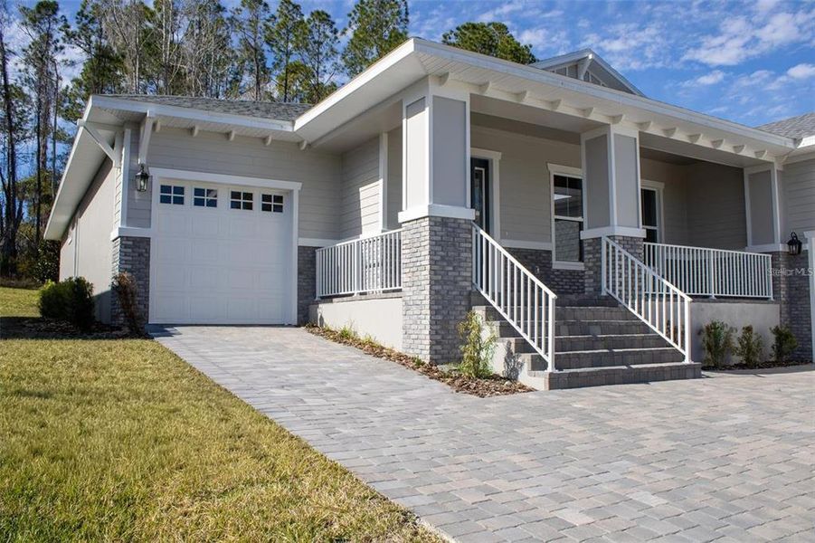 Front exterior of a new home in Southern Hills Plantation, Brooksville, FL, highlighting curb appeal (Image 18).
