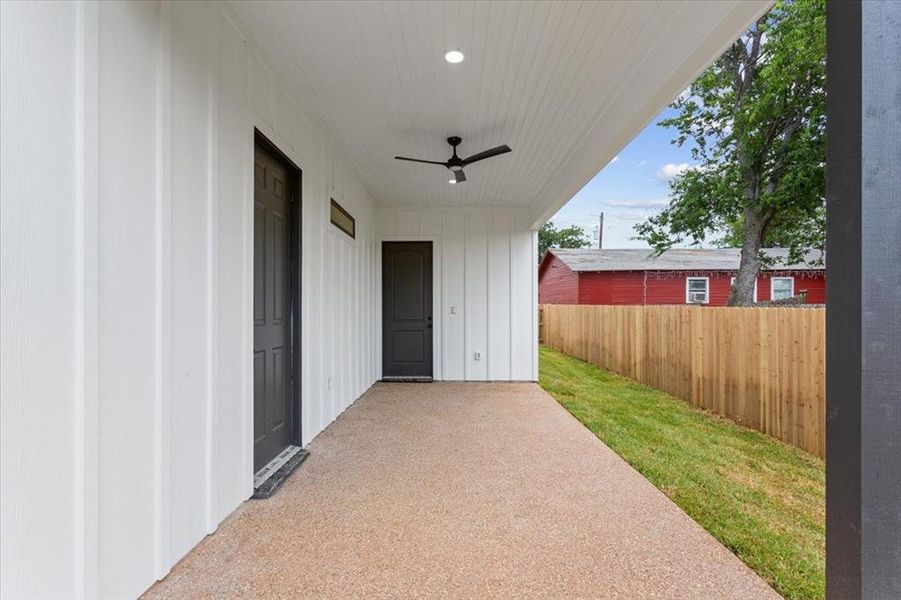 View of back patio / terrace featuring ceiling fan View of back patio / terrace featuring ceiling fan