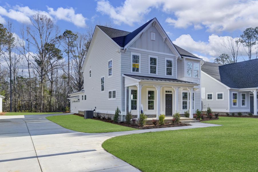 Front exterior of a new home in Clubside Reserve at Summerlake, Lexington, SC, highlighting curb appeal (Image 2). Front exterior of a new home in Clubside Reserve at Summerlake, Lexington, SC, highlighting curb appeal (Image 2).