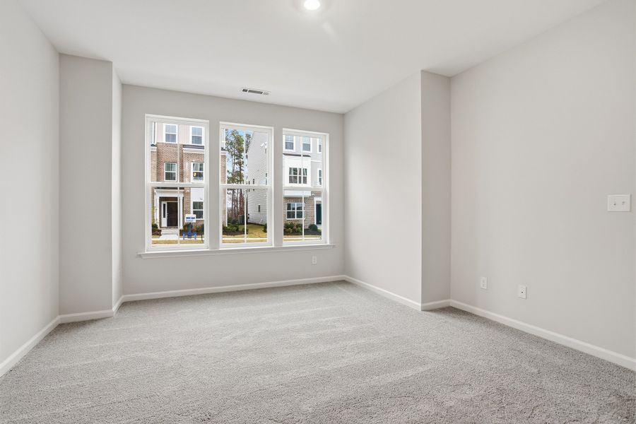 Spacious, unfurnished interior of a new home in Renaissance at White Oak, Garner (Image 32).