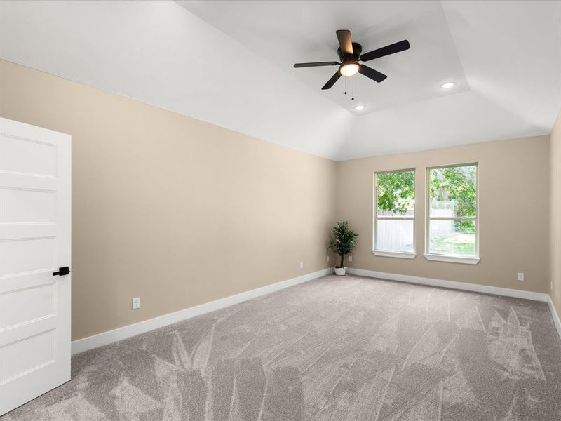 Unfurnished room featuring ceiling fan, light colored carpet, recessed lighting, and lofted ceiling