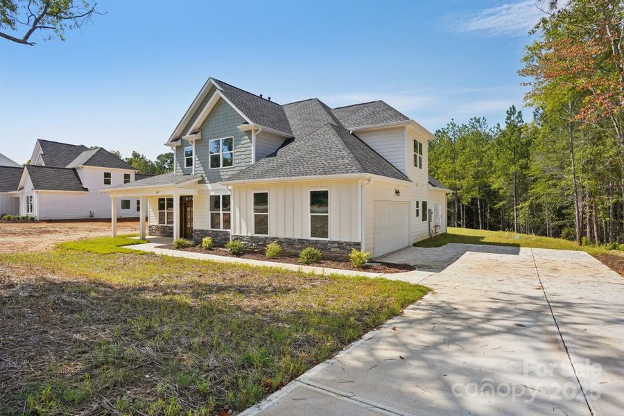 Front exterior of a new home in , Rock Hill, SC, highlighting curb appeal (Image 23).