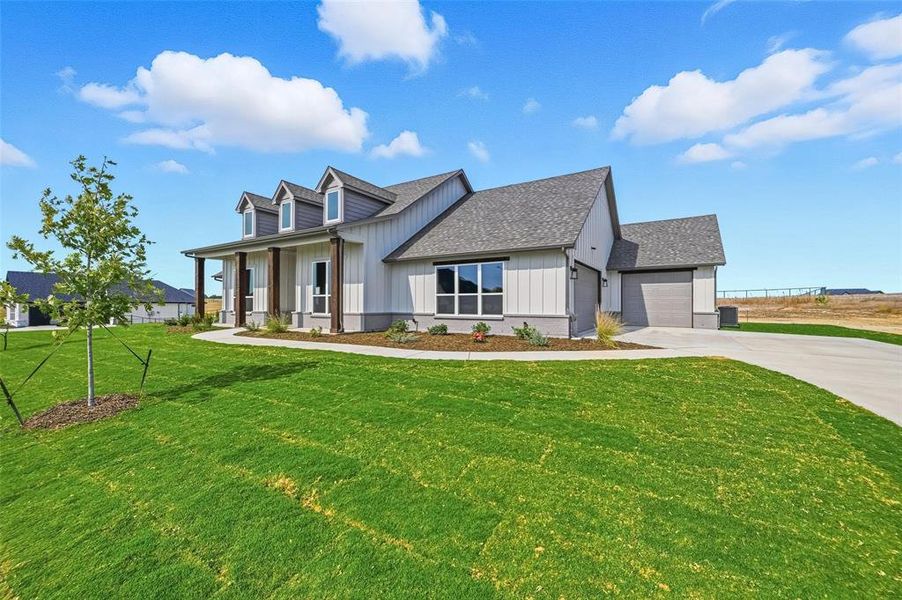 Front exterior of a new home in Rocky Top Ranch, Reno, TX, highlighting curb appeal (Image 2). Front exterior of a new home in Rocky Top Ranch, Reno, TX, highlighting curb appeal (Image 2).