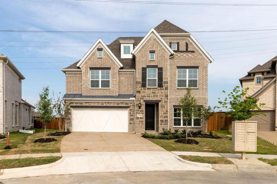 View of front of property with a garage